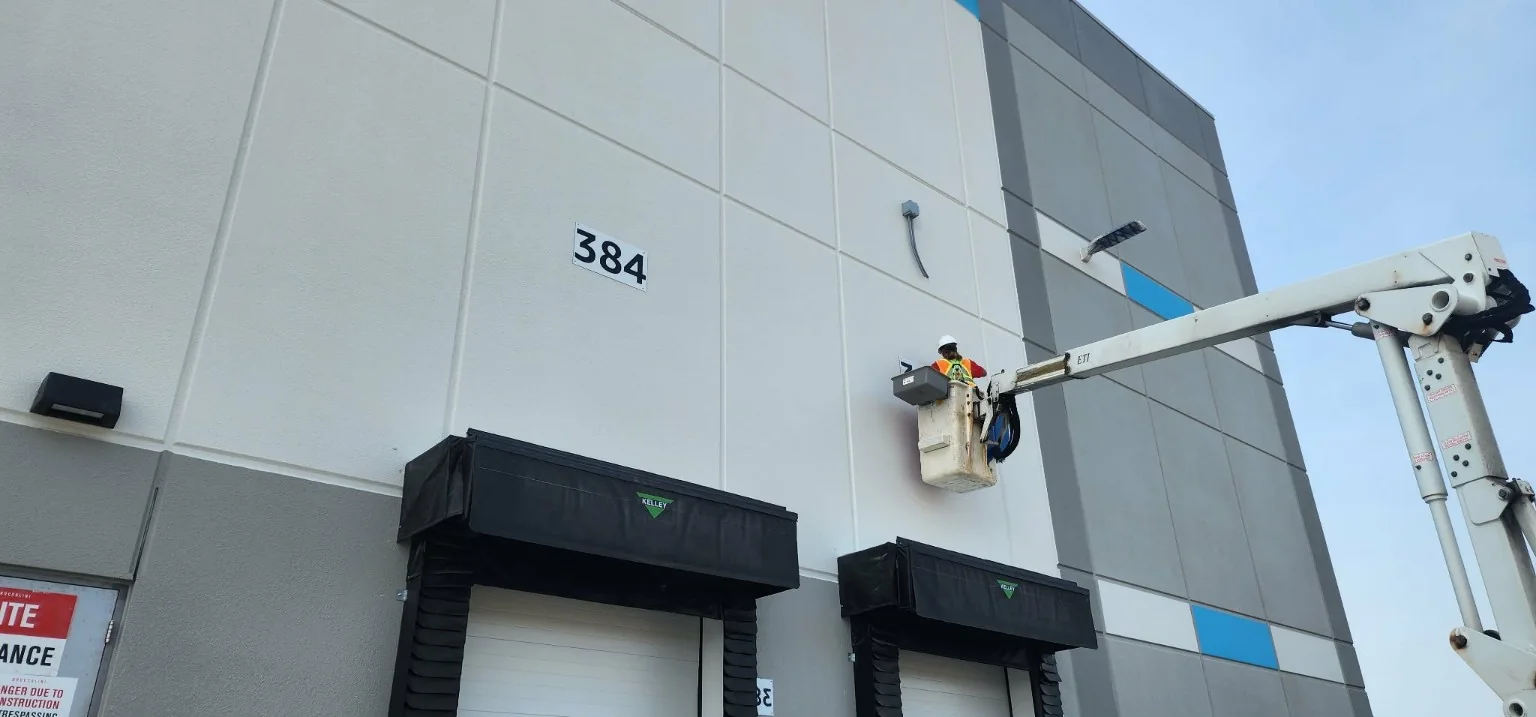 Elevated exterior commercial installation completed from lift equipment