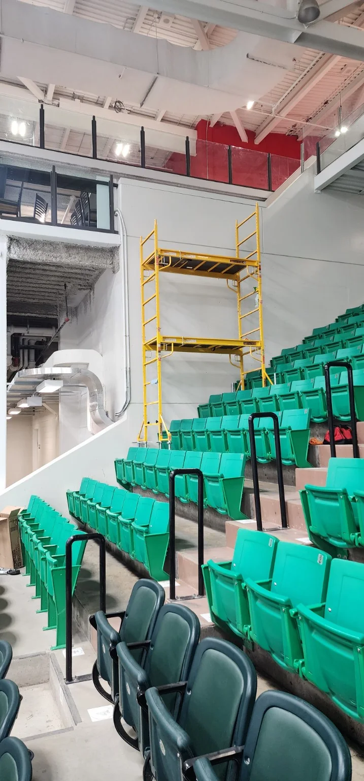 Scaffolding set up in the Belleville Senators arena seating area for graphics installation access
