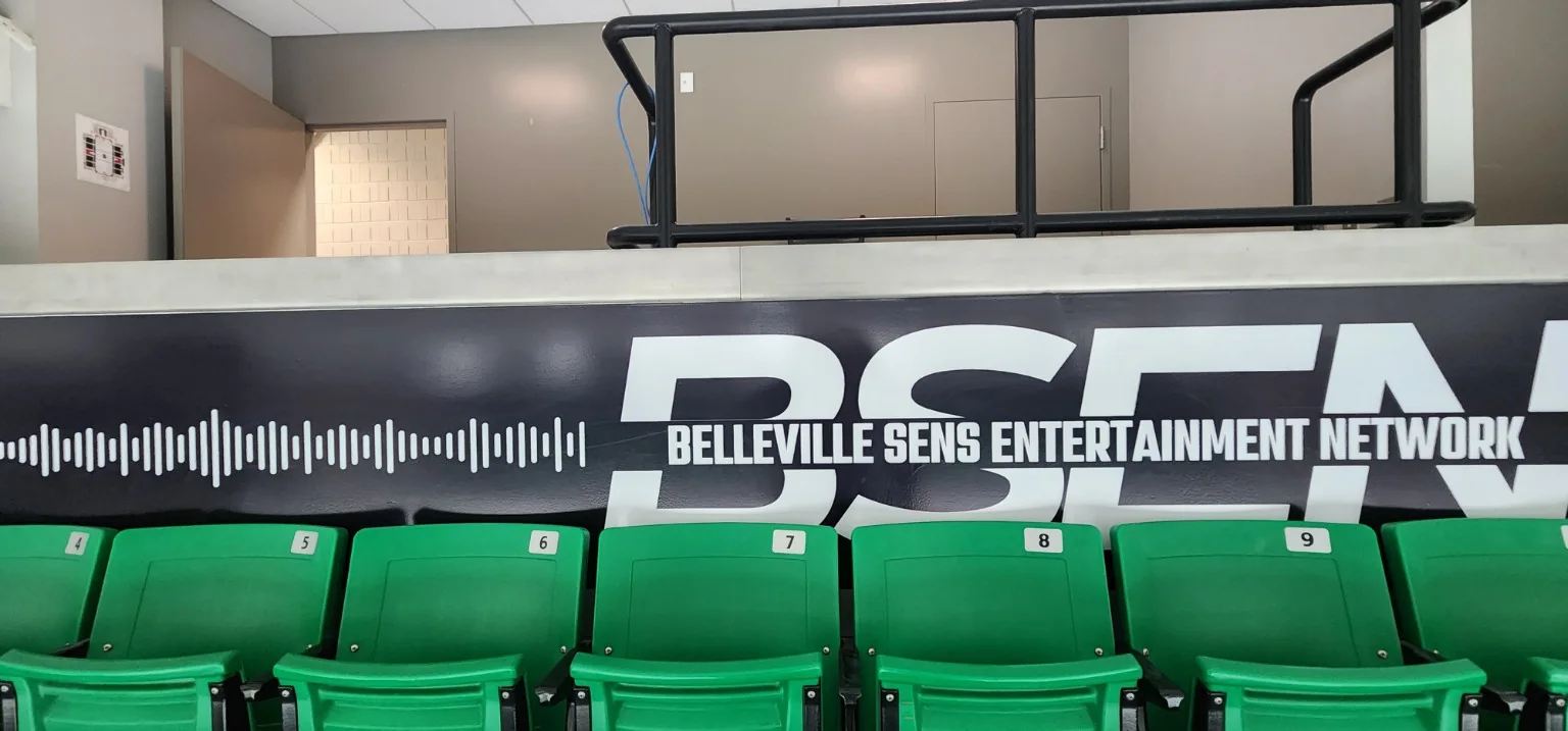 Close view of the finished Belleville Sens Entertainment Network BSEN wall graphic behind arena seats
