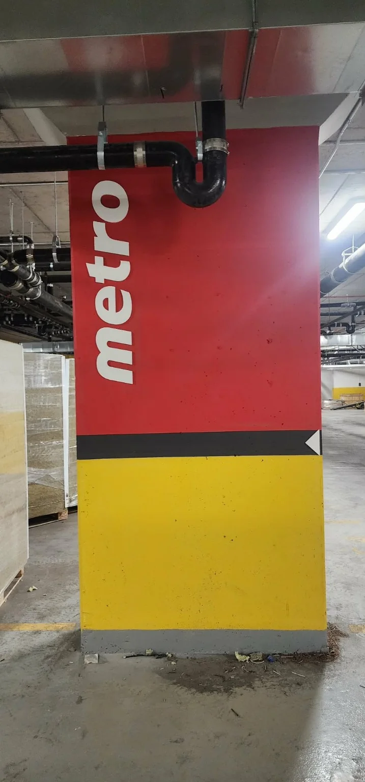 Metro branded pillar graphic inside a retail store