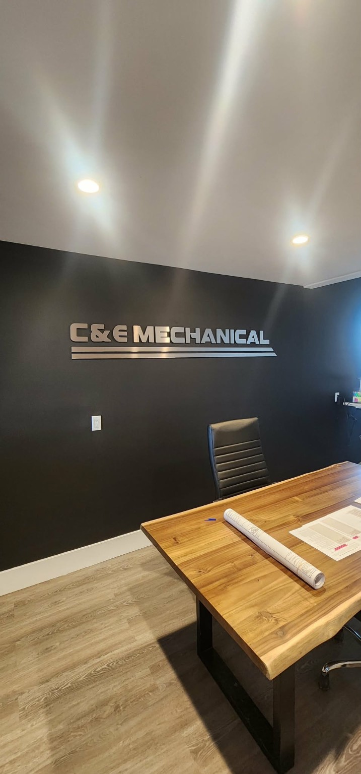 C and E Mechanical dimensional wall logo installed in a commercial office