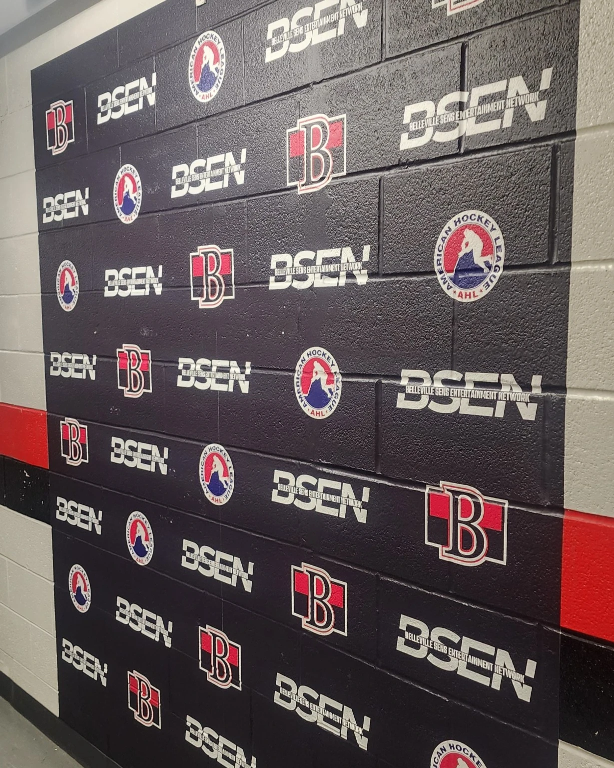 Belleville Senators branded graphics installed across a textured block wall