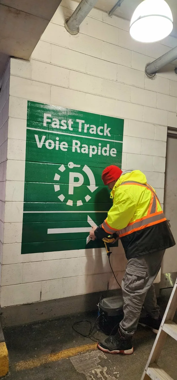Commercial textured concrete and block wayfinding graphic installation