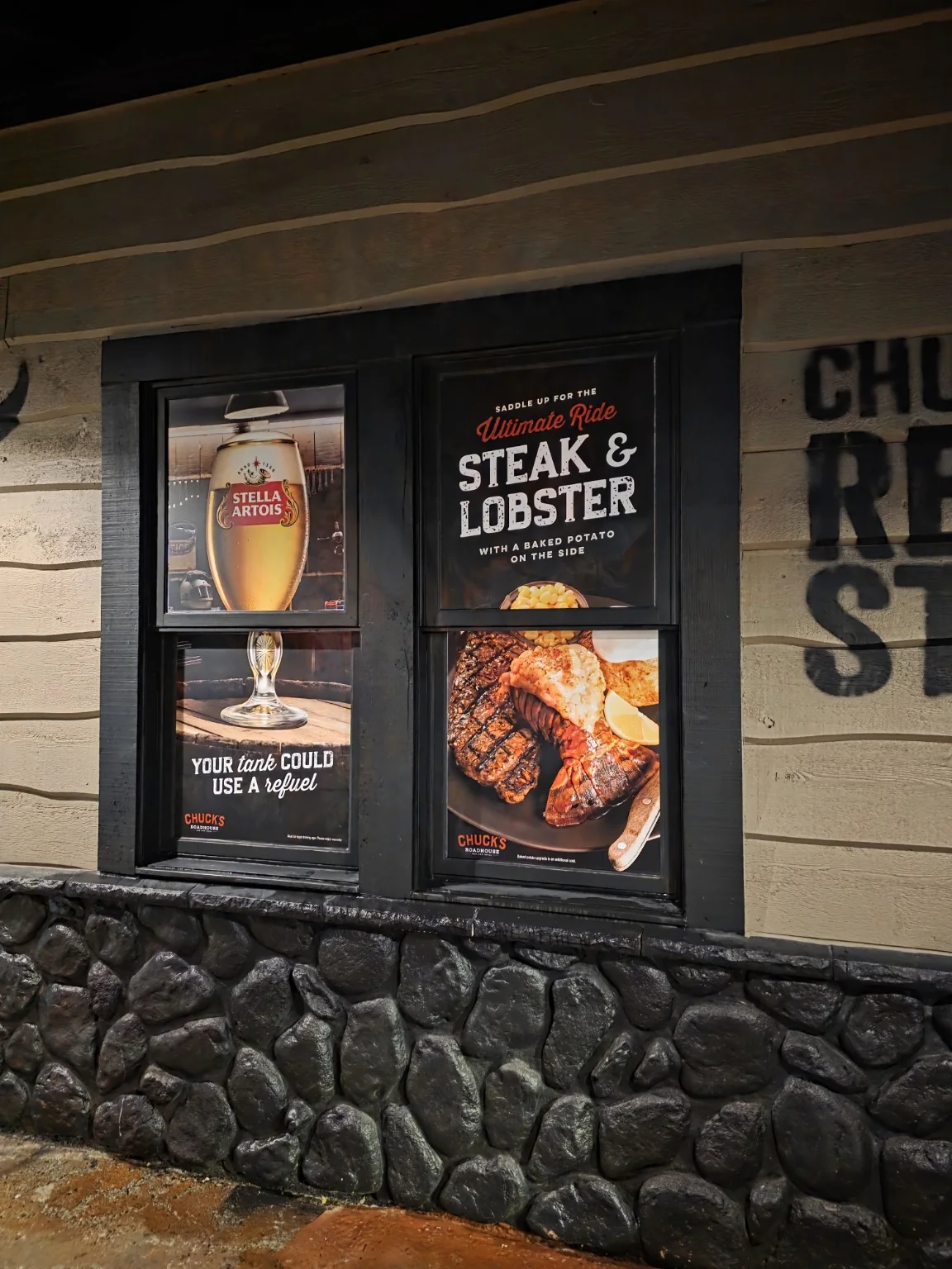 Chuck's Roadhouse finished steak and lobster promotional window graphics